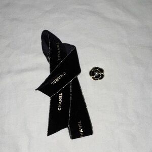 CHANEL Black Ribbon with Gold Flower Brooch